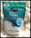 Flaky Sea Salt 225g in a bed of natural salt harvested from the Southern Pacific Ocean